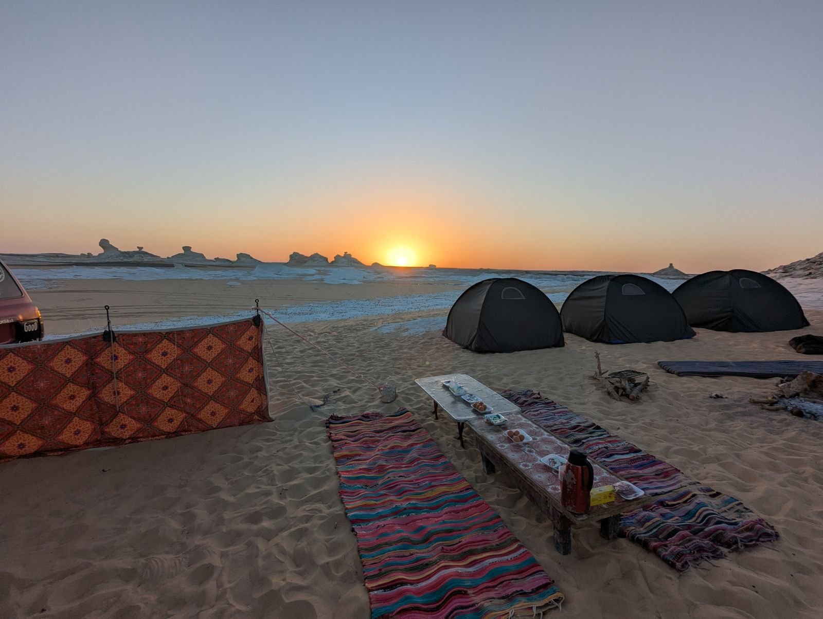 Golden sunset over White Desert limestone formations in Egypt
